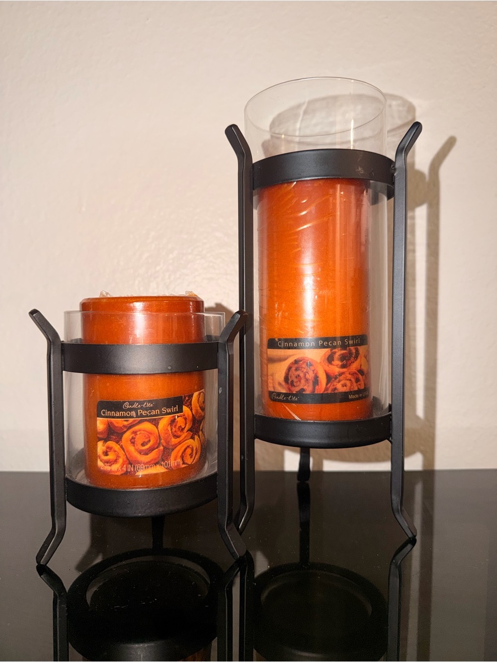 Cinnamon Pecan Swirl Orange Decorative Pillar Candle Set with Black Holders